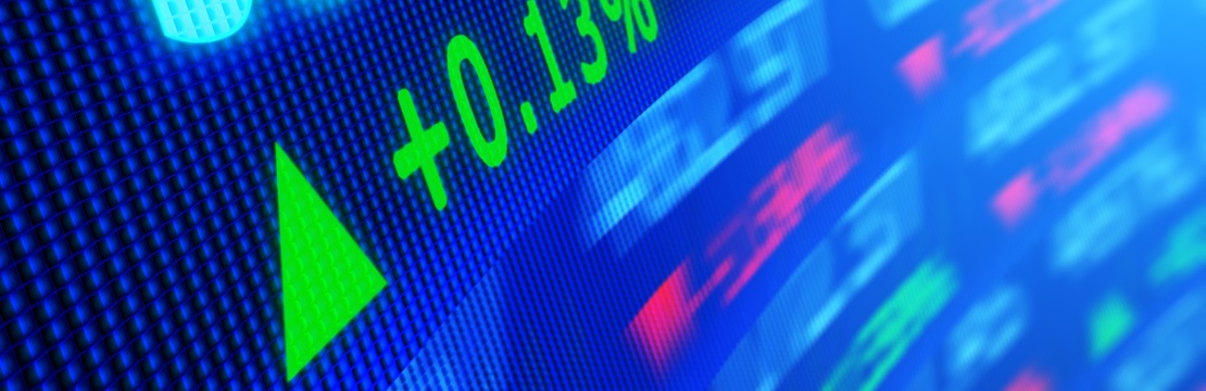 Side angle view of stock market data on video display board