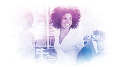 Smiling young woman in office holding file folder